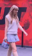 Taylor Swift pairs cable-knit vest with pleated miniskirt at Nebraska vs. Cincinnati game