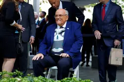 Rudy Giuliani arrives at Ground Zero for 9/11 memorial ceremony in wheelchair and body brace